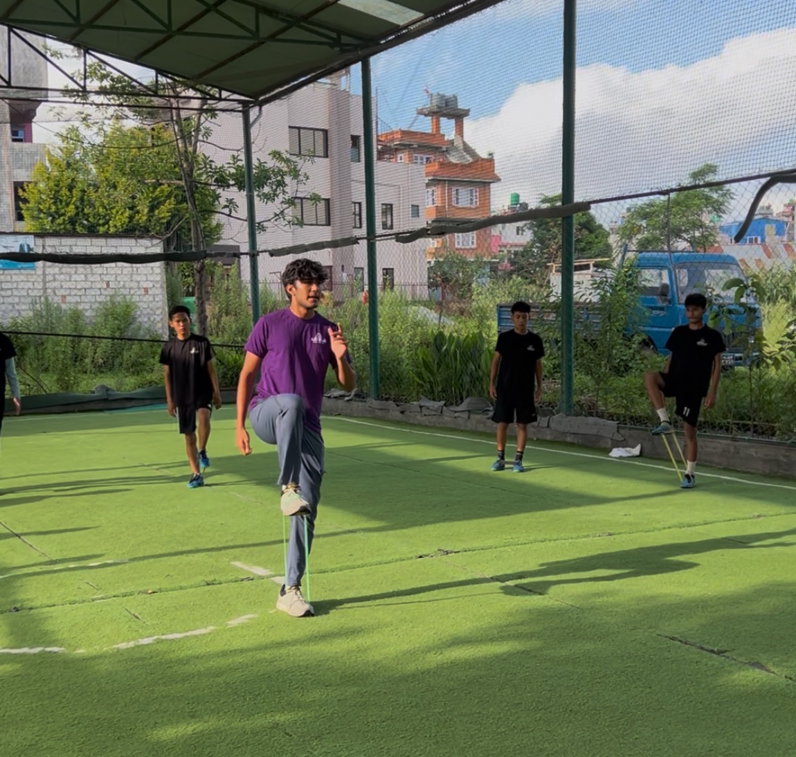 Alan Risal demonstrates a hip stability exercise at the HYAF and A4B sports wellness session