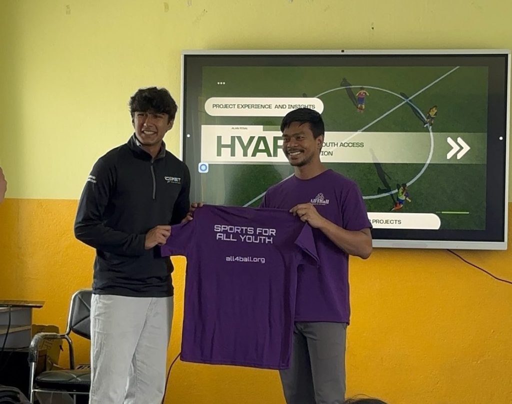 Alan Risal receiving a shirt from Mr. Sagendra (All for Ball)